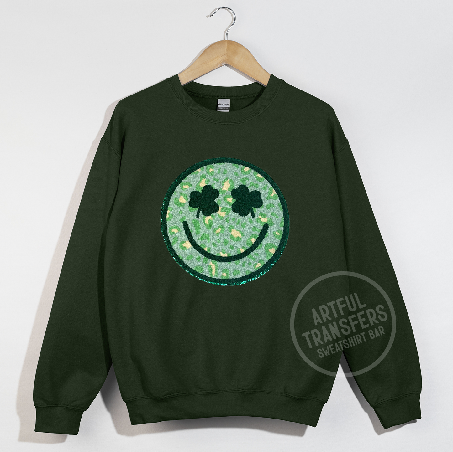 Clover-Eyed Smiley Chenille Patch on Forest Green Crewneck Sweatshirt
