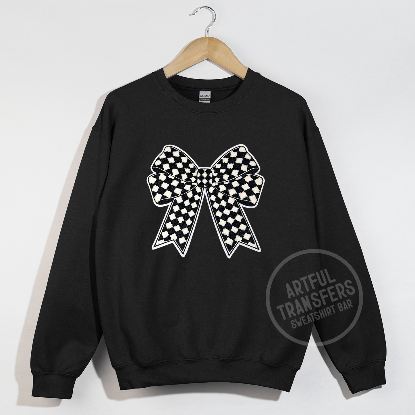 The Checkered Bow Chenille Patch on Black Crewneck Sweatshirt